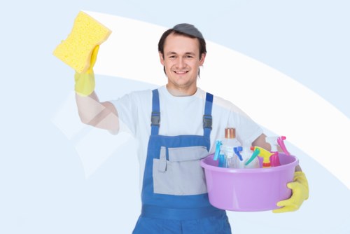 Commercial cleaning team sanitizing workplace surfaces
