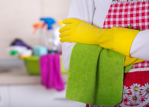 A cleaner performing one off cleaning tasks in a bathroom