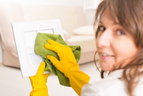Vacuuming upholstered furniture to remove dust and allergens